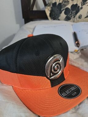 Hot Topic Black and Orange Snapback Hat with Metal Emblem